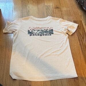 Patagonia Light Pink Tee with Multicolor Graphic